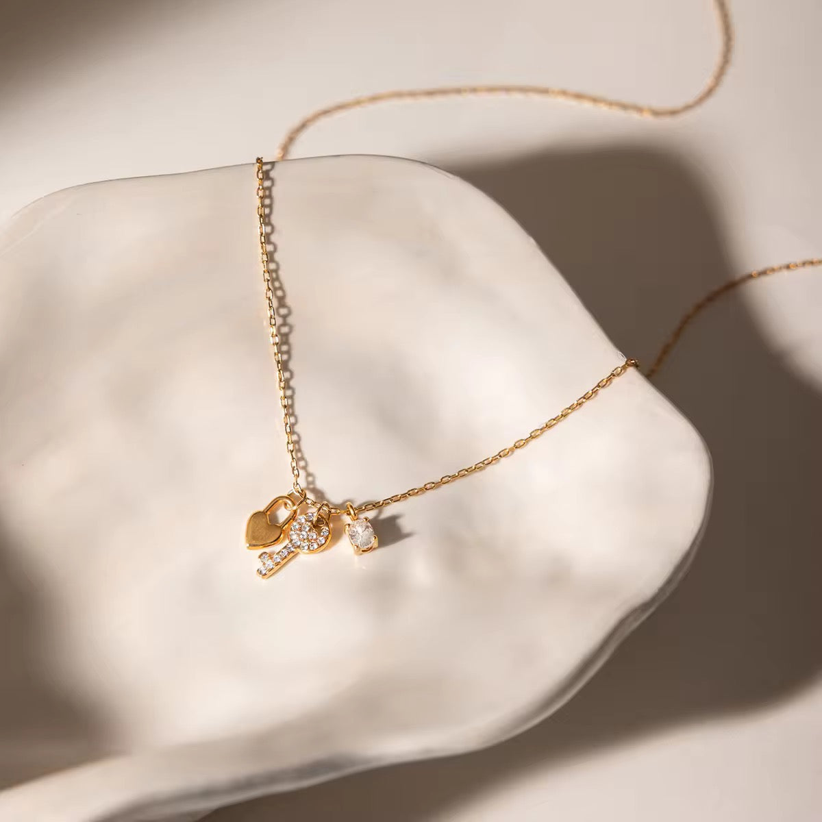KEY CHARM NECKLACE